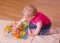 Bigjigs Baby Placa de atividades em madeira com flores