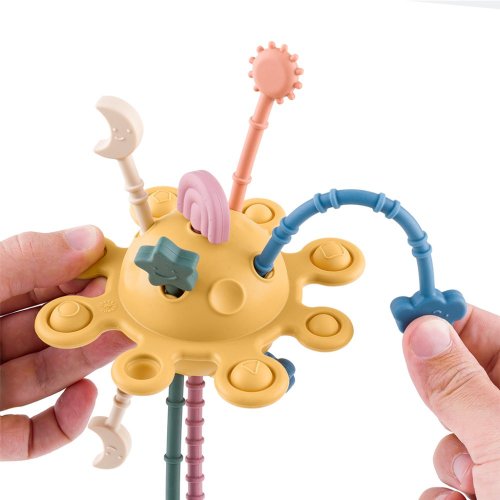 PETITE&MARS Silicone sensory toy Crazy planet Intense Ocher 10m+