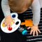 BABY EINSTEIN Sensorisches Musikspielzeug Color Palette Popper 6-36m