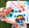 BABYONO Beißring edukativ mit Rassel Orange