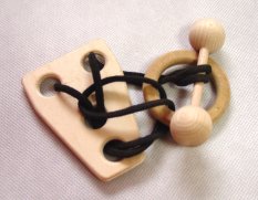 Casse-tête en bois haltère