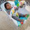 BABY EINSTEIN Musikwippe mit Vibration und Lichtern Kick to It Neptune bis 9 kg